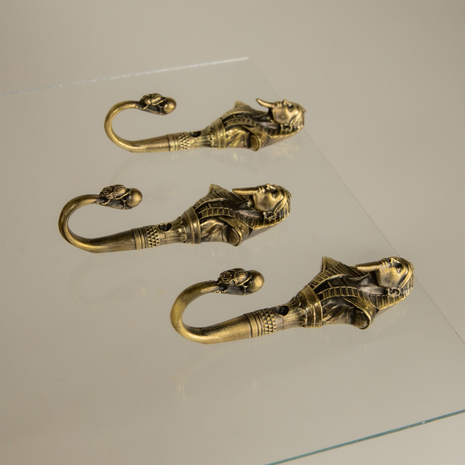 Pharaoh wall hook, a solid brass hook in the style of ancient Egypt.