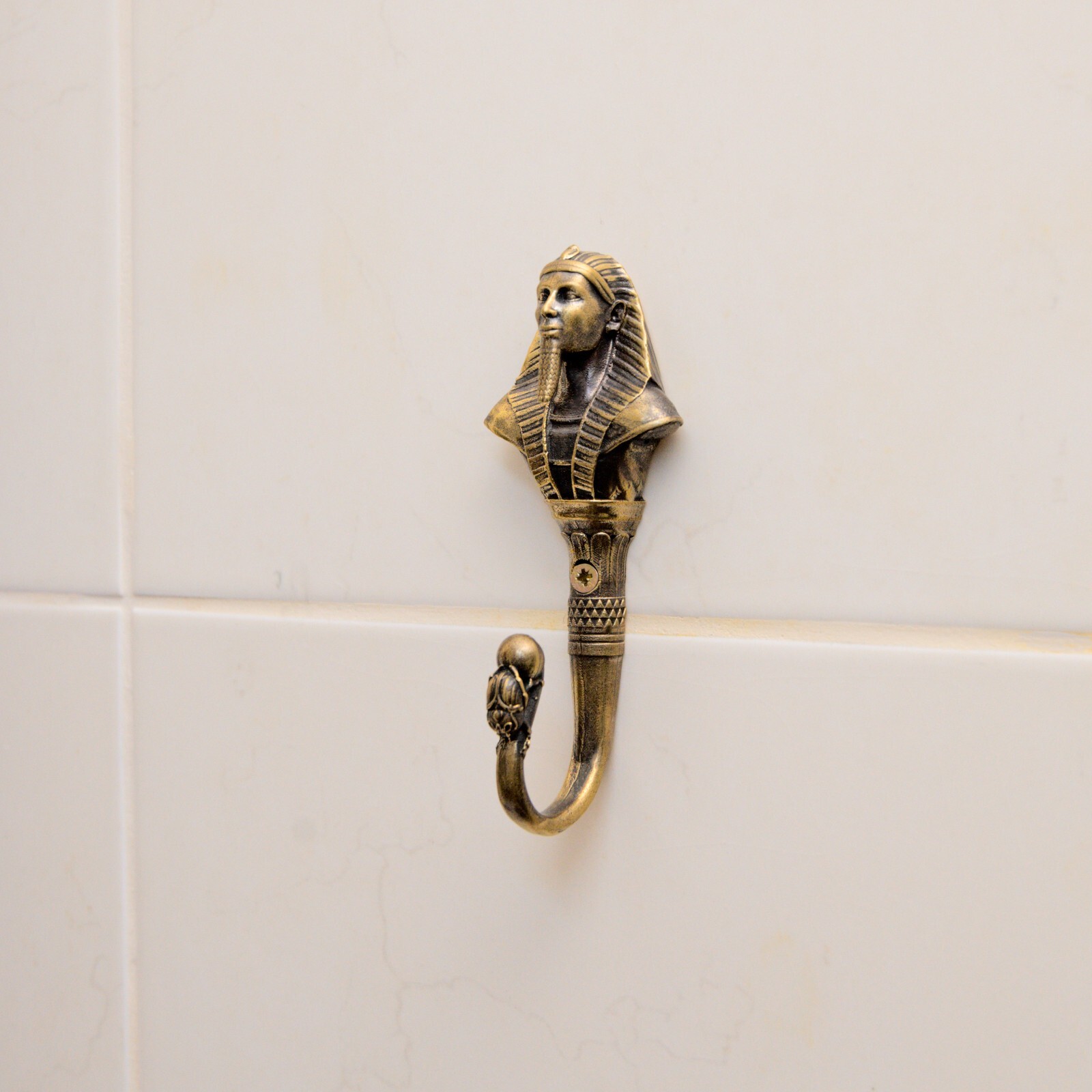 Pharaoh wall hook, a solid brass hook in the style of ancient Egypt.