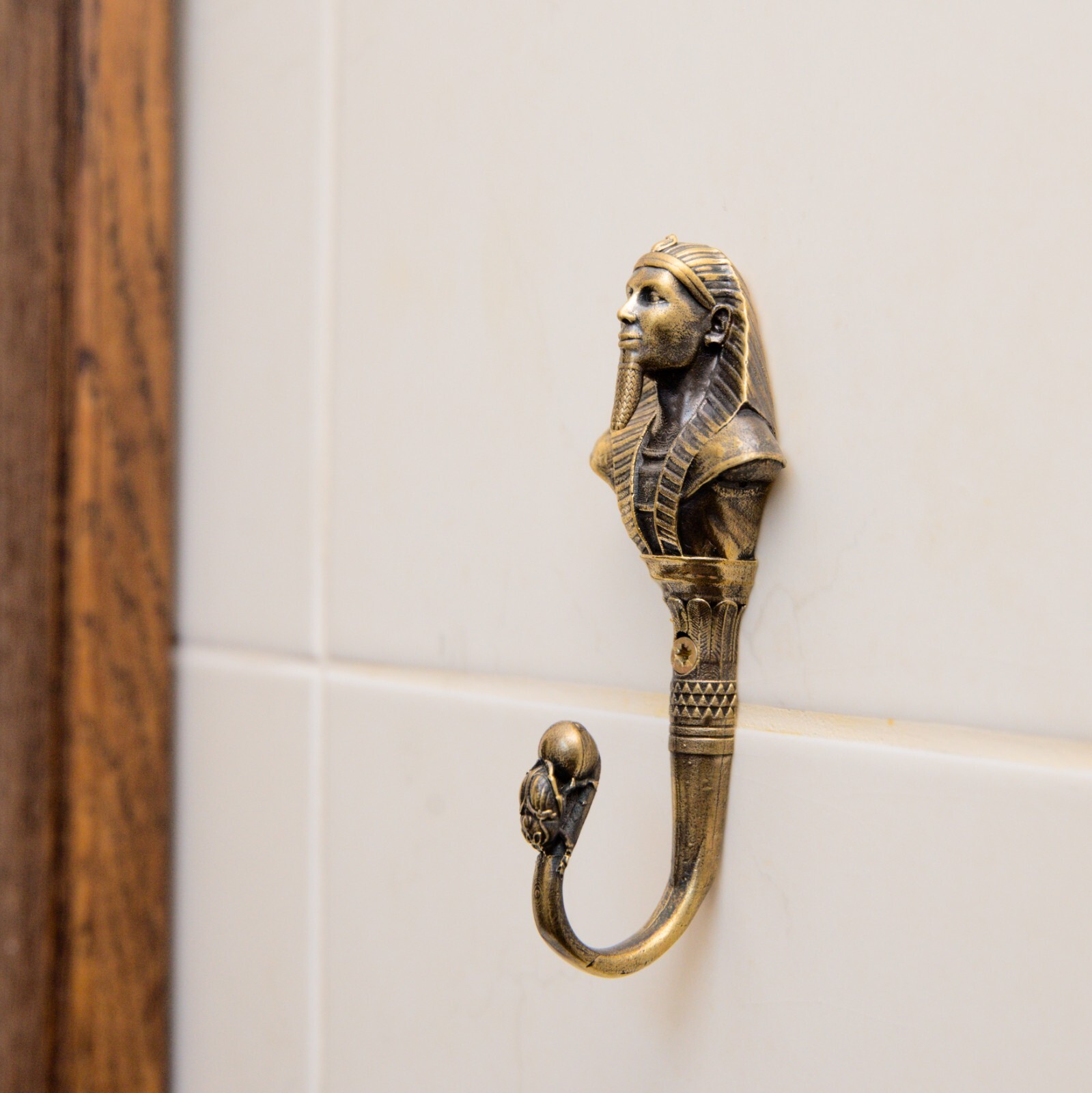 Pharaoh wall hook, a solid brass hook in the style of ancient Egypt.
