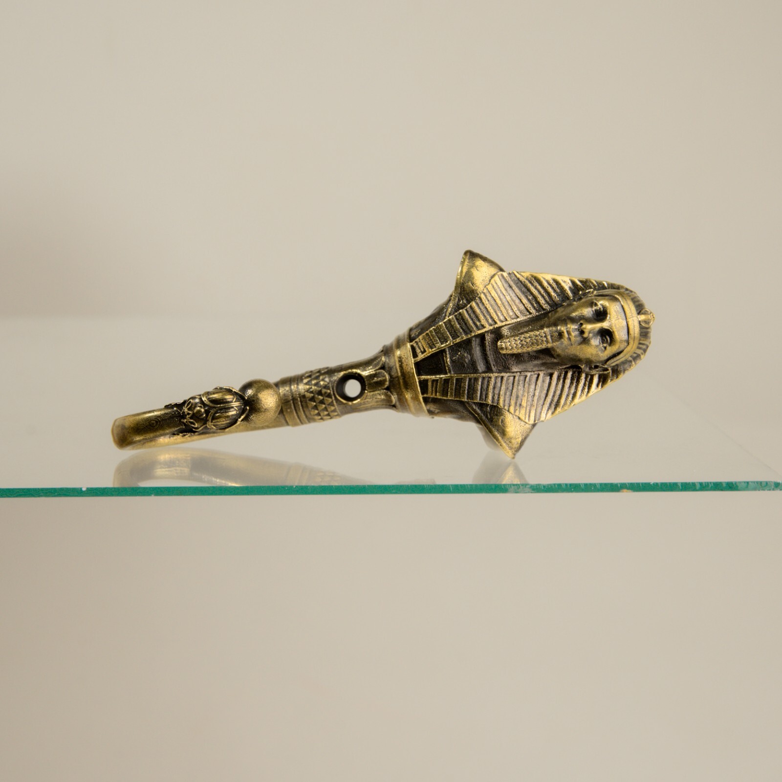 Pharaoh wall hook, a solid brass hook in the style of ancient Egypt.