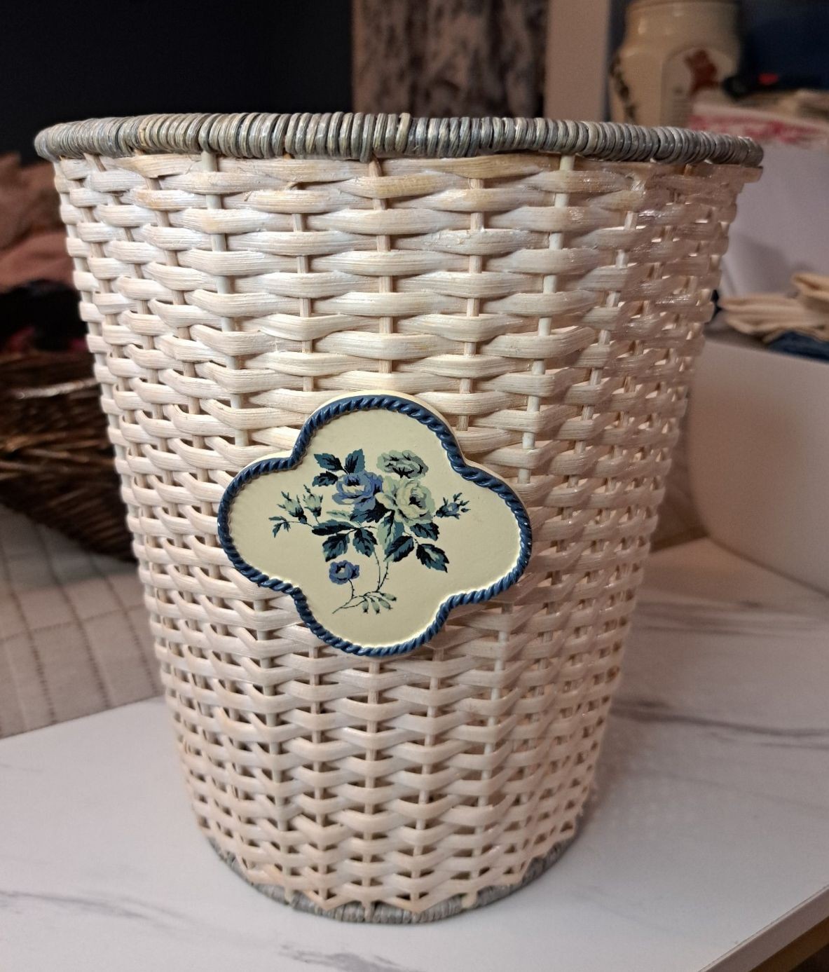 Vintage White Wicker and Rattan w/ Quatrefoil Blue Floral Plaque Wastebasket 10″