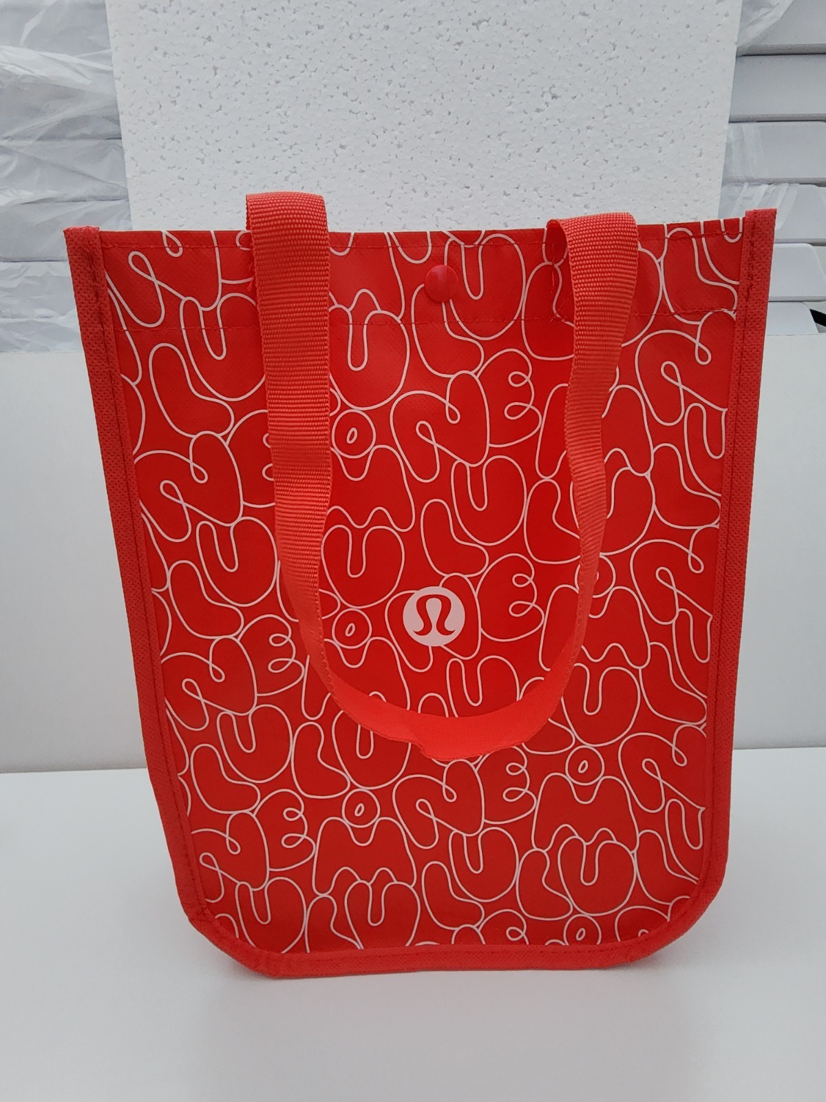 Lululemon Small Logo Reusable Shoppers Bag Red w/ logos all over front and back.